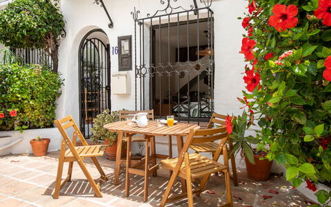 Carmen: Furniture, Flowerpot, Outdoor Furniture, Chair, Table, Door, Houseplant, Outdoor Table, Porch