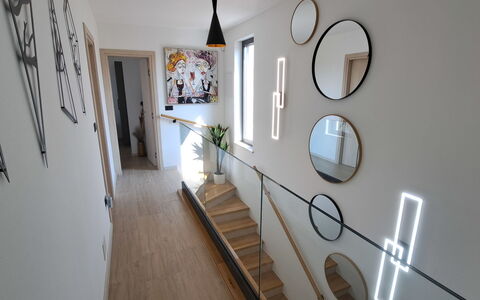 Val: Interior Design, Furniture, Wood, Flooring, Ceiling, Floor, Room, Lighting, Apartment, Table