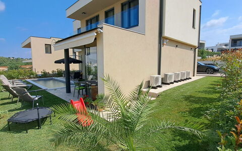 Val: Interior Design, Furniture, Wood, Flooring, Ceiling, Floor, Room, Lighting, Apartment, Table