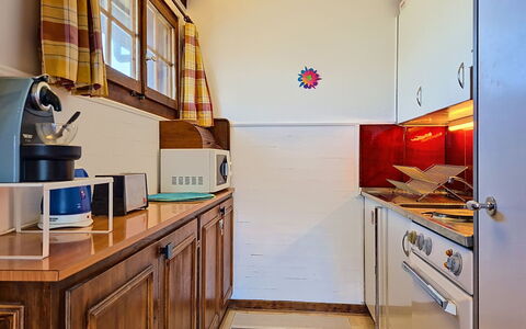 Balcon du Ciel 1: Wood, Interior Design, Flooring, Kitchen, Floor, Countertop, Room, Cabinetry, Major Appliance, Furniture