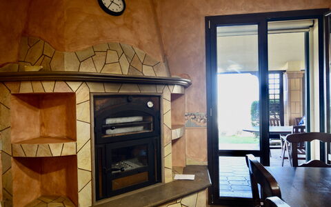 La Villa di Giusy: Wood, Hearth, Wood Stain, Natural Material, Hardwood, Fireplace, Wood-Burning Stove, Home Appliance, Tile, Living Room