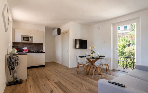 Next Comacina, Lago di Como: Furniture, Flooring, Apartment, Chair, Wood Flooring, Hardwood, Houseplant, Wood Stain, Living Room, Balcony