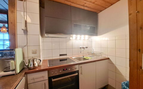 Grafenast: Kitchen, Kitchen Appliance, Countertop, Flooring, Major Appliance, Wood, Kitchen Sink, Cabinetry, Floor, Interior Design