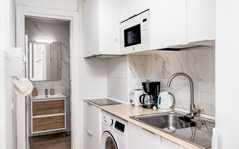 Las Naciones: Kitchen Appliance, Countertop, Major Appliance, Kitchen, Cabinetry, Flooring, Home Appliance, Interior Design, Wood, Floor