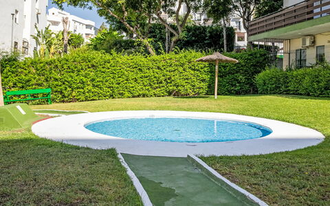 Las Naciones: Swimming Pool, Leisure, Composite Material, Garden, Lawn, Backyard, Landscaping, Artificial Turf, Shade, Yard