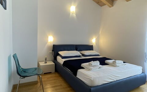 Volme: Furniture, Interior Design, Flooring, Floor, Wood, Ceiling, Room, Bedroom, Bed, Lighting