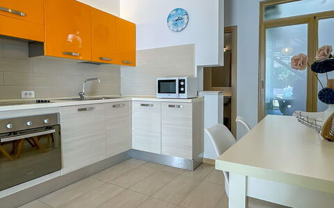 Volme: Flooring, Interior Design, Floor, Wood, Countertop, Furniture, Ceiling, Kitchen, Light Fixture, Kitchen Appliance