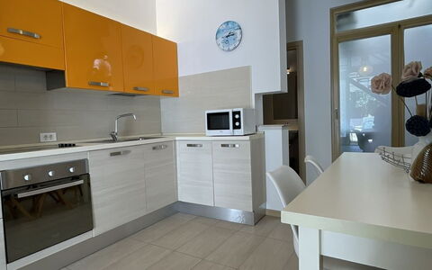 Volme: Flooring, Interior Design, Floor, Furniture, Wood, Ceiling, Countertop, Kitchen, Room, Lighting