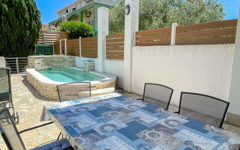 Volme: Furniture, Outdoor Furniture, Table, Chair, Outdoor Table, Floor, Shade, Kitchen & Dining Room Table, Balcony, Patio