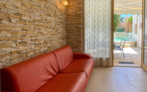 Volme: Wall, Flooring, Interior Design, Floor, Ceiling, Lighting, Furniture, Couch, Room, Living Room