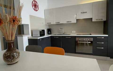 Volme: Furniture, Interior Design, Flooring, Floor, Wood, Ceiling, Light Fixture, Lighting, Countertop, Kitchen