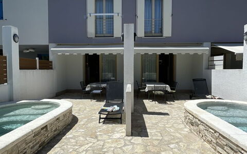 Volme: Swimming Pool, Composite Material, Outdoor Furniture, Concrete, Shade, Resort, Chair, Estate, Tile, Courtyard