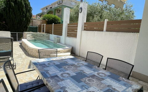 Volme: Furniture, Outdoor Furniture, Chair, Table, Outdoor Table, Floor, Shade, Kitchen & Dining Room Table, Balcony, Coffee Table
