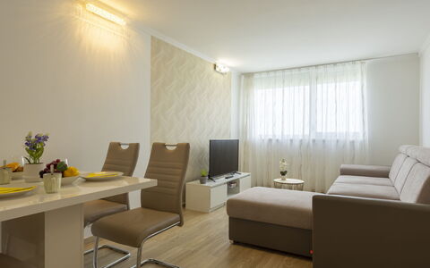 Silver: Furniture, Interior Design, Flooring, Floor, Couch, Wood, Ceiling, Room, Lighting, Living Room