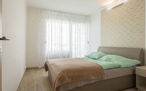 Silver: Bed, Interior Design, Furniture, Bedroom, Wall, Floor, Flooring, Room, Wood, Ceiling