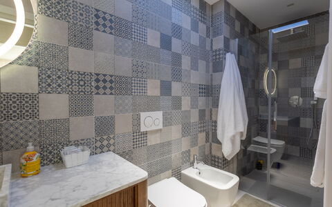 Terrazza Mare, Jacuzzi and Seaview: Flooring, Floor, Bathroom, Interior Design, Plumbing Fixture, Tile, Toilet, Toilet Seat, Composite Material, Mosaic