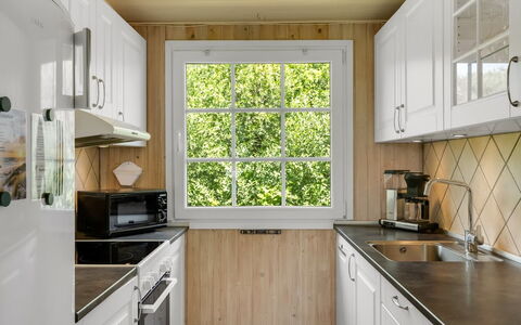 Isabel - 650M from the Sea: Kitchen, Countertop, Kitchen Appliance, Wood, Interior Design, Flooring, Plumbing Fixture, Major Appliance, Cabinetry, Kitchen Sink