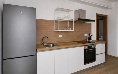 Villa Blue: Kitchen, Flooring, Cabinetry, Countertop, Kitchen Appliance, Furniture, Interior Design, Major Appliance, Wood, Floor
