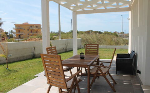 Villa Blue: Furniture, Wood, Outdoor Furniture, Floor, Flooring, Chair, Shade, Outdoor Structure, Outdoor Table, Pergola