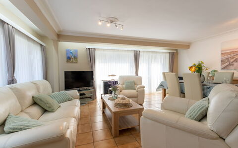 Centrally Located Sea You Again: Furniture, Interior Design, Couch, Flooring, Floor, Living Room, Ceiling, Room, Table, Wood