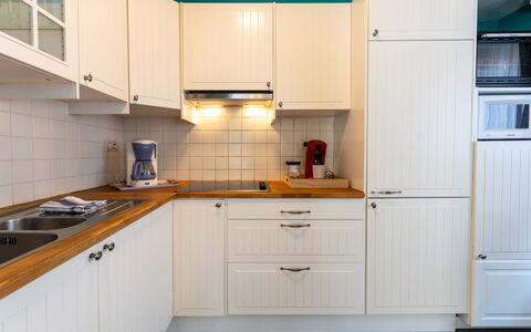 Centrally Located Sea You Again: Kitchen, Cabinetry, Kitchen Appliance, Major Appliance, Countertop, Wood, Interior Design, Kitchen Sink, Flooring, Cupboard