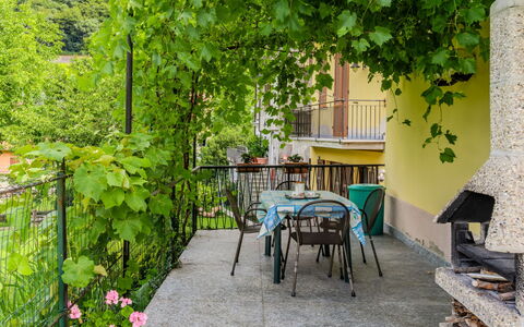 Casa Iolanda: Furniture, Chair, Outdoor Furniture, Table, Outdoor Table, Shade, Backyard, Kitchen & Dining Room Table, Garden, Yard