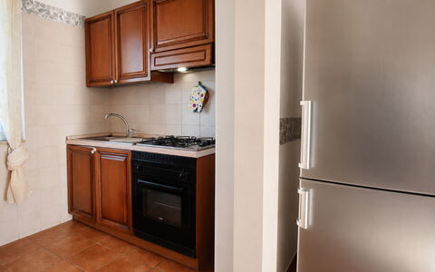 Villa Gertrude: Kitchen Appliance, Kitchen, Major Appliance, Wood, Flooring, Countertop, Cabinetry, Interior Design, Floor, Furniture