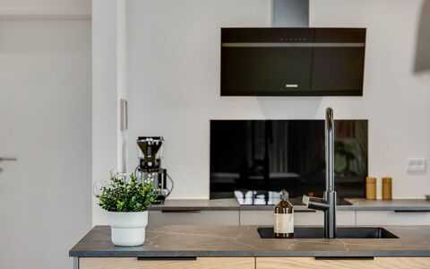 Huldrik - 900M from the Sea: Countertop, Kitchen, Kitchen Appliance, Cabinetry, Interior Design, Furniture, Flooring, Home Appliance, Wood, Major Appliance