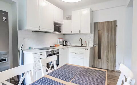 Prague Castle Oasis: Furniture, Kitchen, Interior Design, Flooring, Kitchen Appliance, Major Appliance, Wood, Countertop, Floor, Cabinetry