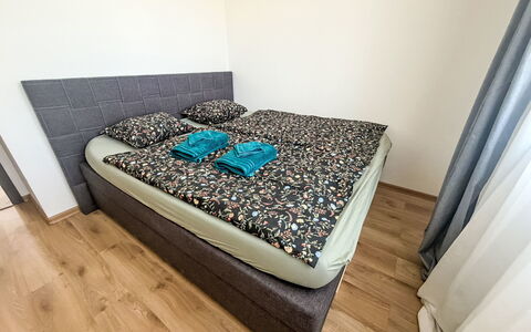 Horní Líšnice: Flooring, Bedroom, Floor, Bed, Linens, Room, Bedding, Bed Frame, Wood Flooring, Bed Sheet