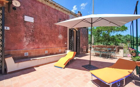 Il Giardino di Lara: Wall, Door, Outdoor Furniture, Chair, Shade, Balcony, Outdoor Table, Wood Stain, Hacienda, Houseplant
