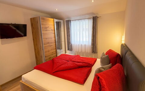 Apartment Bergkristall: Furniture, Wood, Interior Design, Flooring, Bed, Floor, Room, Bedroom, Ceiling, Lighting