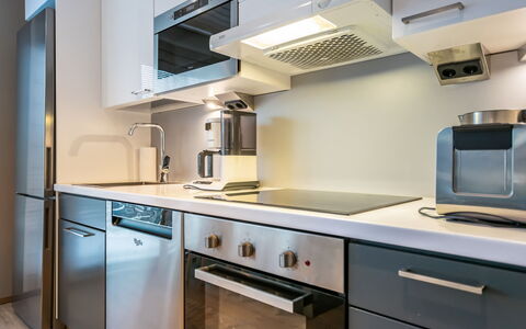 Golfarinkunnas 9A: Kitchen Appliance, Kitchen, Countertop, Cabinetry, Major Appliance, Kitchen Stove, Home Appliance, Interior Design, Stove, Flooring