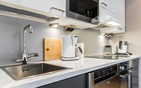 Golfarinkunnas 9C: Kitchen, Countertop, Kitchen Appliance, Cabinetry, Major Appliance, Home Appliance, Kitchen Stove, Interior Design, Plumbing Fixture, Stove