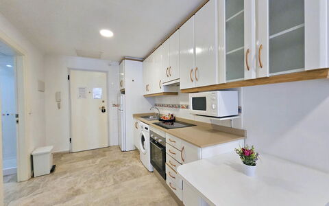 Apartamento Alba 1: Flooring, Interior Design, Wood, Floor, Furniture, Countertop, Ceiling, Kitchen, Cabinetry, Room