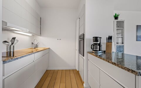 Svane - 70M from the Sea: Kitchen, Countertop, Kitchen Appliance, Flooring, Interior Design, Cabinetry, Major Appliance, Wood, Floor, Home Appliance