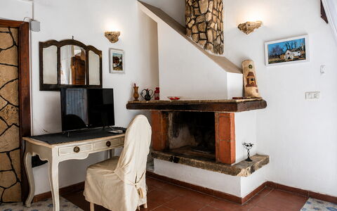 Casa Dafne: Wall, Furniture, Wood, Interior Design, Lighting, Room, Chair, Living Room, Hardwood, Wood Stain