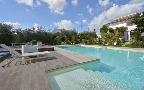 La Dimora di Diana: Swimming Pool, Resort, Composite Material, Garden, Landscaping, Water Feature, Shade, Eco Hotel, Backyard, Leisure
