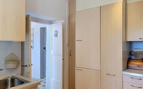 Casa Yakamos: Cabinetry, Furniture, Countertop, Wood, Kitchen Appliance, Flooring, Kitchen, Interior Design, Cupboard, Floor