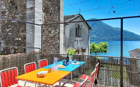 Casa Yakamos: Furniture, Chair, Outdoor Furniture, Outdoor Table, Balcony, Kitchen & Dining Room Table, Flowerpot, Houseplant, Shade, Restaurant