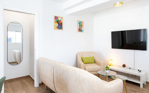 Elvix Nerja Center a: Furniture, Interior Design, Couch, Flooring, Wall, Floor, Living Room, Wood, Room, Home