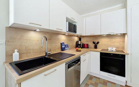 Claire Joie: Countertop, Kitchen, Kitchen Appliance, Cabinetry, Major Appliance, Flooring, Interior Design, Wood, Sink, Plumbing Fixture