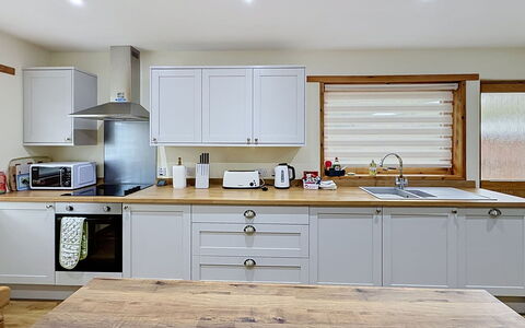 Glencarr: Kitchen, Furniture, Countertop, Kitchen Appliance, Cabinetry, Interior Design, Wood, Flooring, Home Appliance, Major Appliance