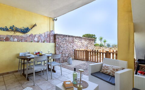 Sunset House Isola Rossa: Blue, Balcony, Handrail, Apartment, Fence, Sea, Resort, Condominium, Swimming Pool, Hotel
