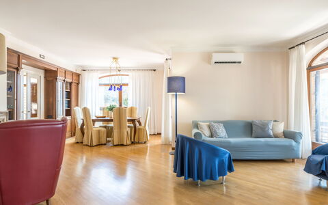 Villa Althea: Furniture, Interior Design, Flooring, Couch, Floor, Wood, Room, Living Room, Ceiling, Apartment