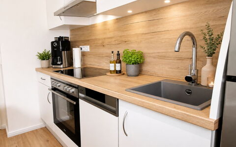 Herzwerk Schwalenberg: Countertop, Kitchen, Flooring, Wood, Kitchen Appliance, Cabinetry, Plumbing Fixture, Sink, Furniture, Interior Design