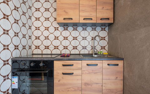 Ilda: Wood, Flooring, Kitchen, Cabinetry, Floor, Countertop, Brown, Major Appliance, Kitchen Appliance, Wood Stain