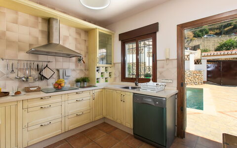 Portichuelo: Kitchen, Countertop, Kitchen Appliance, Cabinetry, Furniture, Interior Design, Major Appliance, Flooring, Sink, Kitchen Sink
