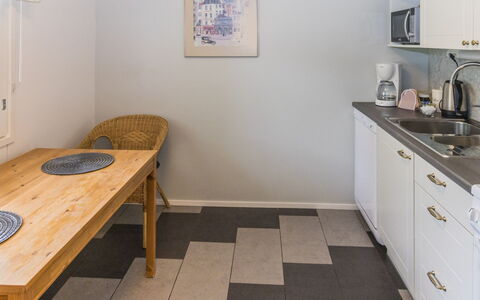 Pirtti: Flooring, Floor, Wood, Interior Design, Furniture, Major Appliance, Countertop, Kitchen, Kitchen Appliance, Lighting
