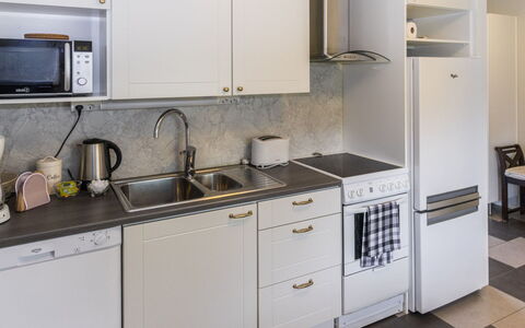 Pirtti: Kitchen Appliance, Kitchen, Countertop, Major Appliance, Kitchen Sink, Cabinetry, Kitchen Stove, Sink, Flooring, Home Appliance